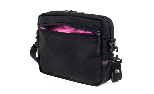 The Side Kick in Black Ballistic with an Cerise (pink with white grid) 200 Halcyon interior.